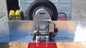 Electric winch with remote control used for towing and positioning of loads.